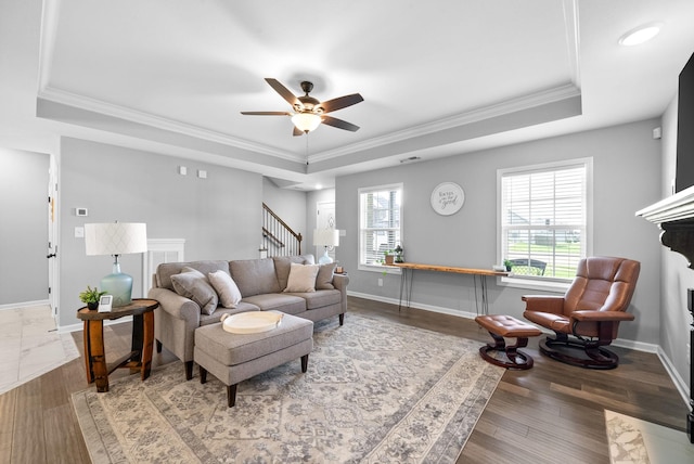 324 Kildeer Dr, Clarksville, TN 37040 - living room with a raised ceiling, ceiling fan, ornamental molding, stairs, and baseboards