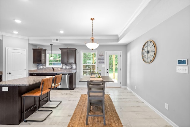324 Kildeer Dr, Clarksville, TN 37040 - kitchen with dishwasher, crown molding, a sink, dark brown cabinetry, and light marble finish flooring