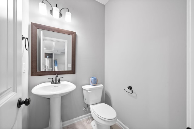 324 Kildeer Dr, Clarksville, TN 37040 - bathroom with toilet, baseboards, and a sink
