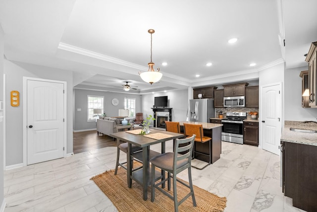 324 Kildeer Dr, Clarksville, TN 37040 - dining room featuring ceiling fan, recessed lighting, baseboards, crown molding, and a fireplace