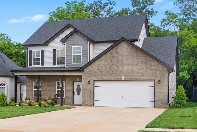 324 Kildeer Dr, Clarksville, TN 37040 - view of front of home with a porch, brick siding, driveway, a garage, and roof with shingles
