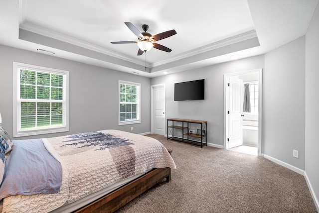 324 Kildeer Dr, Clarksville, TN 37040 - carpeted bedroom featuring a tray ceiling, crown molding, baseboards, ensuite bathroom, and a ceiling fan
