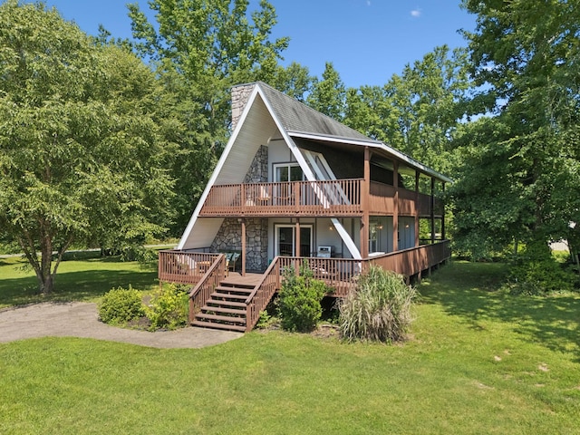 117 Sparrow Ln, Dover, TN 37058 - rear view of house with a chimney, a yard, a wooden deck, stairway, and a balcony