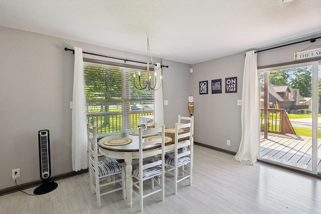 117 Sparrow Ln, Dover, TN 37058 - dining space featuring light wood-style flooring and a chandelier