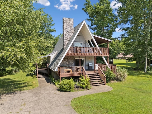 117 Sparrow Ln, Dover, TN 37058 - a-frame style home featuring a front yard, a chimney, stairway, a wooden deck, and a balcony