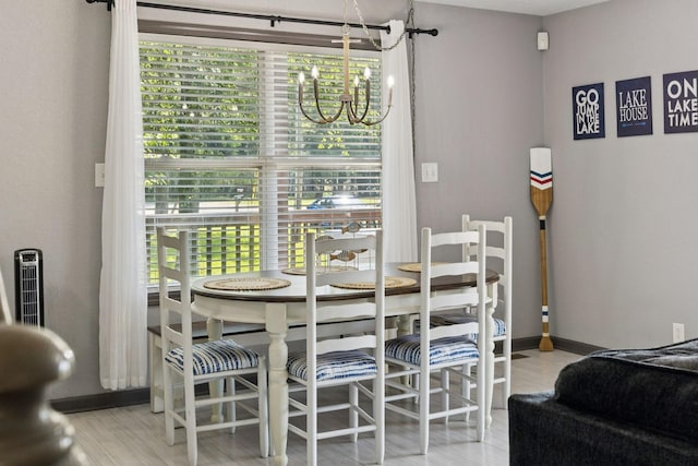 117 Sparrow Ln, Dover, TN 37058 - dining room with a chandelier, healthy amount of natural light, and wood finished floors