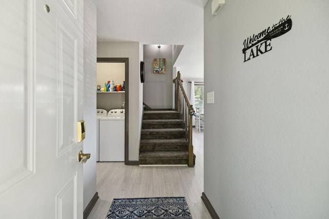 117 Sparrow Ln, Dover, TN 37058 - stairway featuring washing machine and clothes dryer and wood finished floors