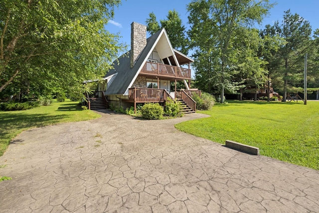 117 Sparrow Ln, Dover, TN 37058 - a-frame home with a front lawn, a wooden deck, a chimney, and stairs