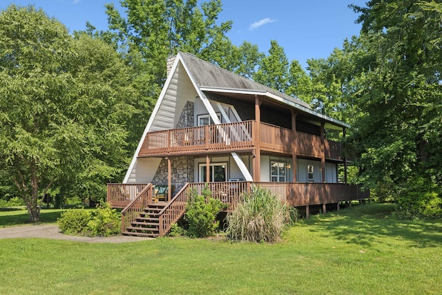 117 Sparrow Ln, Dover, TN 37058 - back of house with a yard, a deck, stone siding, and a balcony