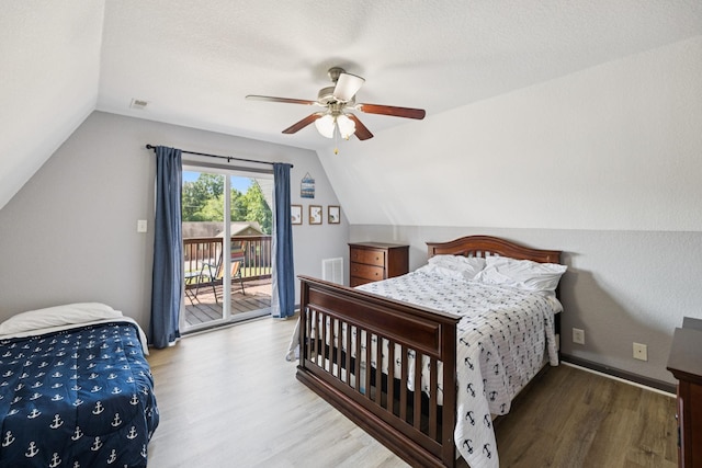 117 Sparrow Ln, Dover, TN 37058 - bedroom with wood finished floors, vaulted ceiling, access to exterior, and a ceiling fan