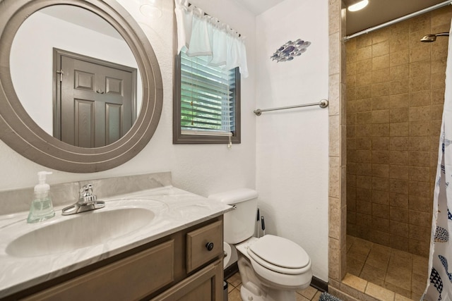 117 Sparrow Ln, Dover, TN 37058 - bathroom featuring vanity, a tile shower, and tile patterned flooring