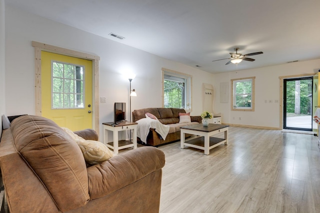 7872 Oscar Green Rd, Primm Springs, TN 38476 - living room with ceiling fan, plenty of natural light, light wood-style flooring, and baseboards