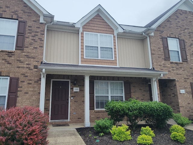 2009 Victory Gallop Ln, Murfreesboro, TN 37128 - view of front of home with brick siding, covered porch, and board and batten siding