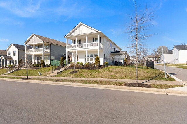 3309 Longstalk Rd, Antioch, TN 37013 - view of front of home featuring board and batten siding, a residential view, and a balcony