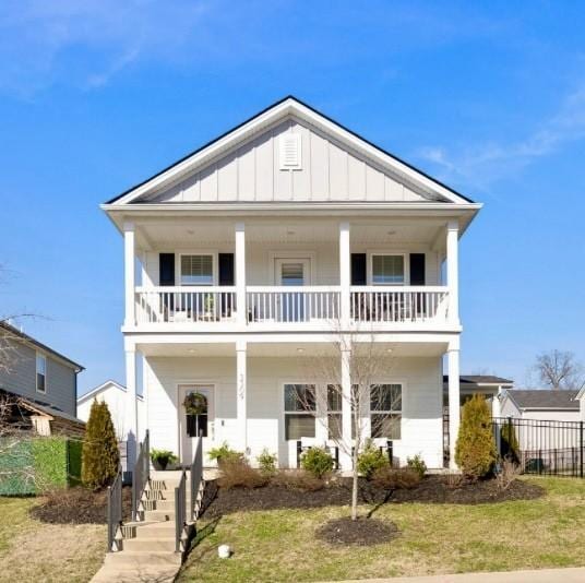 3309 Longstalk Rd, Antioch, TN 37013 - view of front of property with a balcony, board and batten siding, stairway, and a porch