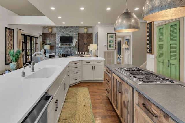 238 Pelham Dr, Brentwood, TN 37027 - kitchen with a sink, appliances with stainless steel finishes, open floor plan, recessed lighting, and dark wood-type flooring
