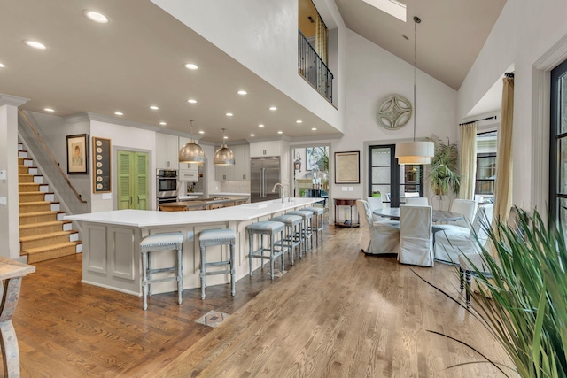 238 Pelham Dr, Brentwood, TN 37027 - kitchen with appliances with stainless steel finishes, a spacious island, light countertops, healthy amount of natural light, and recessed lighting