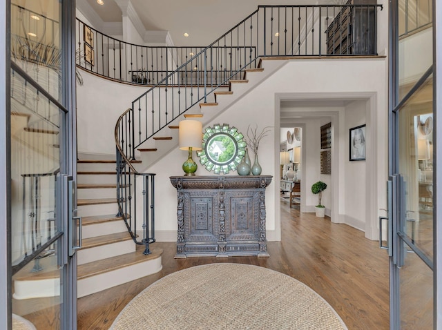 238 Pelham Dr, Brentwood, TN 37027 - entryway with baseboards, stairway, wood finished floors, a high ceiling, and crown molding