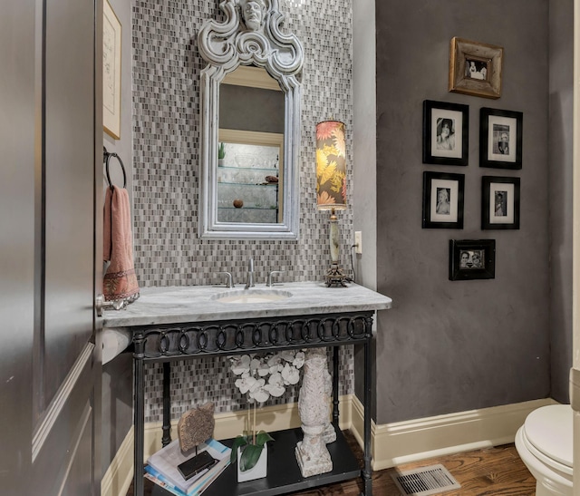 238 Pelham Dr, Brentwood, TN 37027 - bathroom with toilet, wood finished floors, vanity, and baseboards