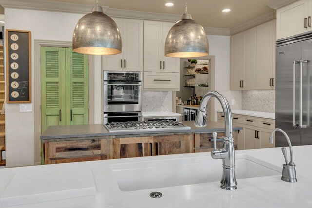 238 Pelham Dr, Brentwood, TN 37027 - kitchen featuring stainless steel appliances, decorative backsplash, decorative light fixtures, ornamental molding, and recessed lighting