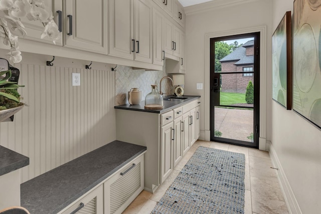 238 Pelham Dr, Brentwood, TN 37027 - mudroom with a sink, baseboards, light tile patterned floors, and crown molding