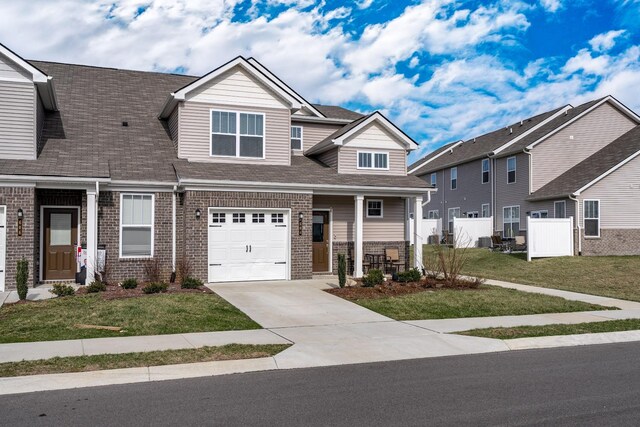 604 Birdie Dr, Spring Hill, TN 37174 - view of front of home featuring brick siding, concrete driveway, a garage, and a shingled roof
