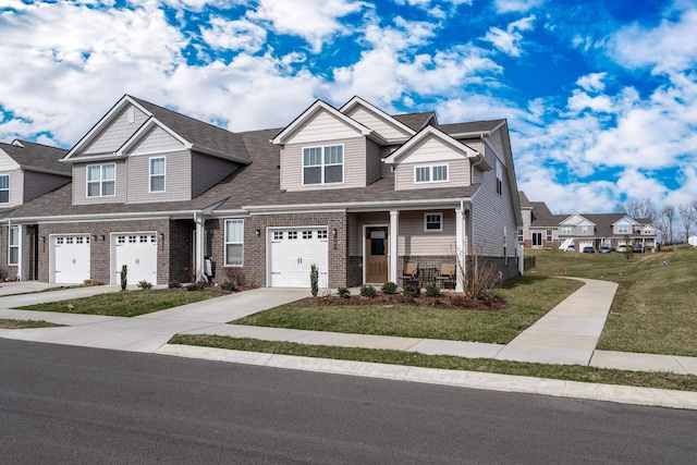 604 Birdie Dr, Spring Hill, TN 37174 - view of front of home featuring brick siding, a front lawn, an attached garage, concrete driveway, and covered porch