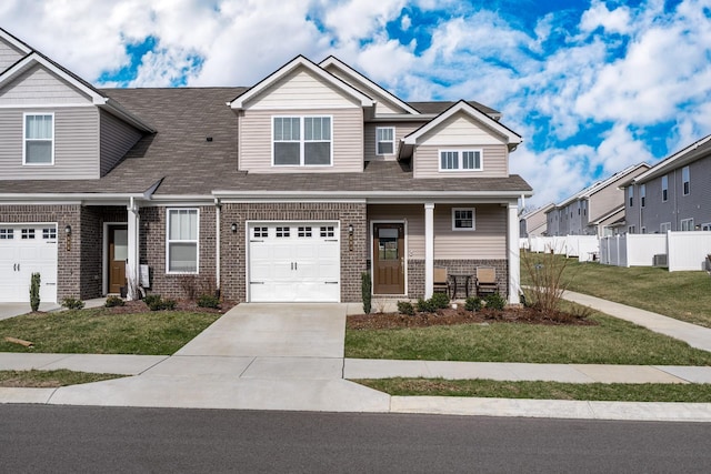 604 Birdie Dr, Spring Hill, TN 37174 - view of front of house with brick siding, a porch, concrete driveway, an attached garage, and a shingled roof