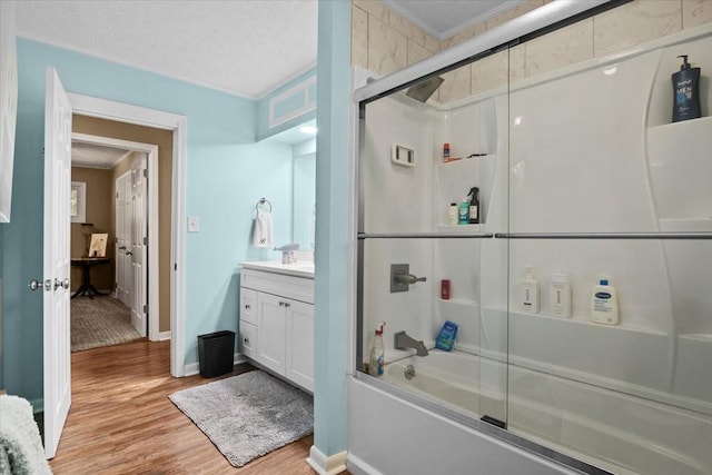 210 Lankford St, Bruceton, TN 38317 - bathroom with shower / bath combination with glass door, wood finished floors, vanity, ornamental molding, and baseboards