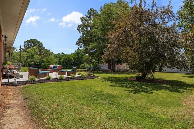 210 Lankford St, Bruceton, TN 38317 - view of grassy yard with an outdoor living space and a patio