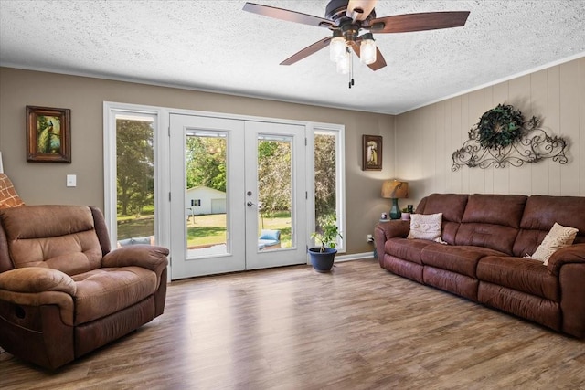 210 Lankford St, Bruceton, TN 38317 - living room featuring french doors, a textured ceiling, wood finished floors, and a ceiling fan