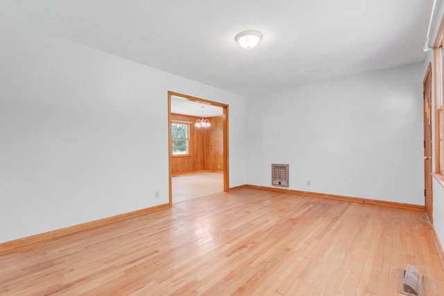 7111 Harrison Dr, Fairview, TN 37062 - empty room with a chandelier and light wood-style floors