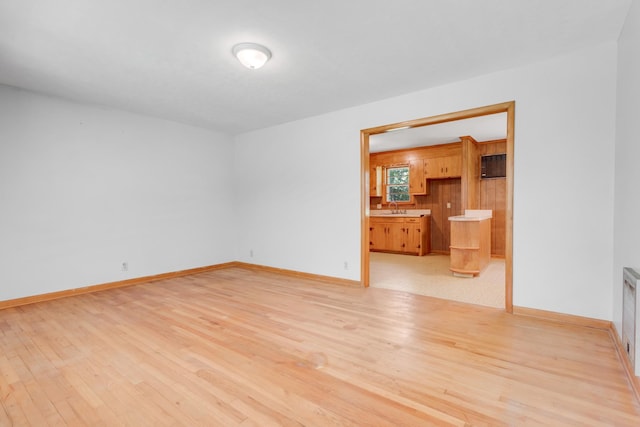7111 Harrison Dr, Fairview, TN 37062 - empty room with light wood-type flooring and a sink