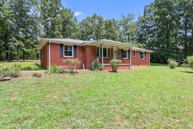 7111 Harrison Dr, Fairview, TN 37062 - ranch-style home featuring covered porch, a front yard, and brick siding