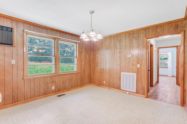 7111 Harrison Dr, Fairview, TN 37062 - empty room featuring a chandelier and wood walls