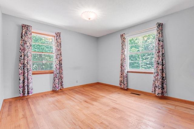 7111 Harrison Dr, Fairview, TN 37062 - empty room featuring wood finished floors and healthy amount of natural light