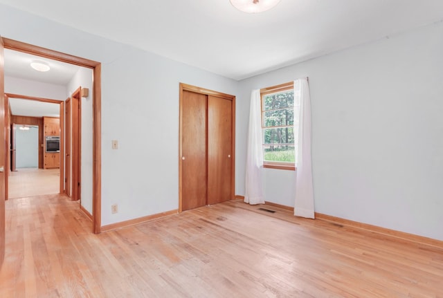 7111 Harrison Dr, Fairview, TN 37062 - unfurnished bedroom with light wood-type flooring and a closet