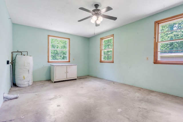 7111 Harrison Dr, Fairview, TN 37062 - unfurnished room featuring concrete flooring, a ceiling fan, and water heater
