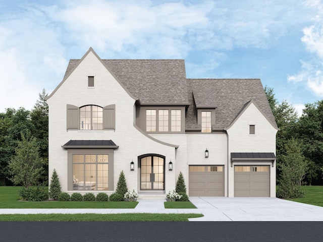 1316 Mcquiddy Rd, Nashville, TN 37221 - french country inspired facade with an attached garage, a standing seam roof, a front lawn, driveway, and brick siding