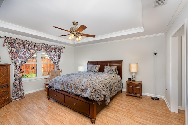 646 Forest Glen Cir, Murfreesboro, TN 37128 - bedroom with light wood-style flooring, baseboards, crown molding, ceiling fan, and a raised ceiling