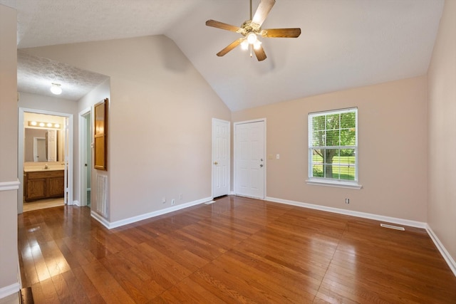 104 Hillcreek Ct, Portland, TN 37148 - empty room with hardwood / wood-style flooring, a ceiling fan, baseboards, high vaulted ceiling, and a sink