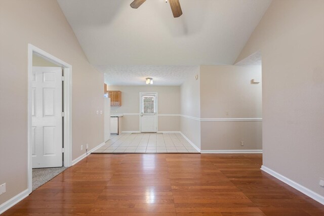 104 Hillcreek Ct, Portland, TN 37148 - unfurnished living room with a ceiling fan, light wood-style flooring, lofted ceiling, and baseboards