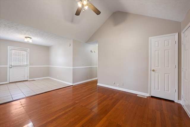 104 Hillcreek Ct, Portland, TN 37148 - spare room featuring ceiling fan, wood finished floors, vaulted ceiling, a textured ceiling, and baseboards