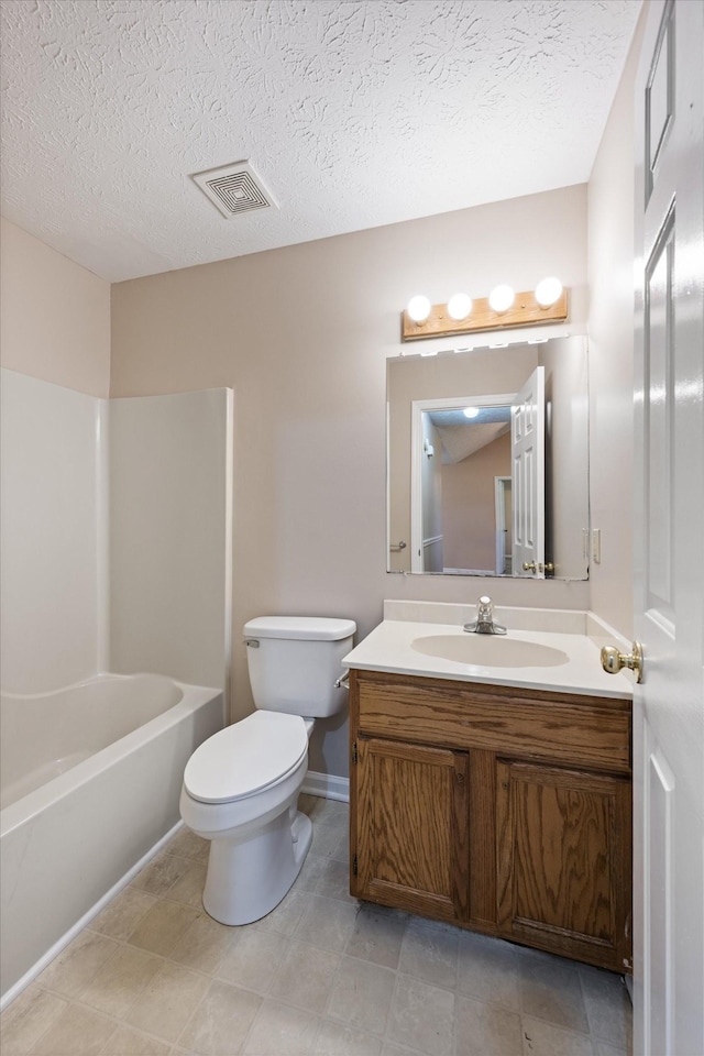 104 Hillcreek Ct, Portland, TN 37148 - bathroom with vanity, toilet, a textured ceiling, bathtub / shower combination, and baseboards