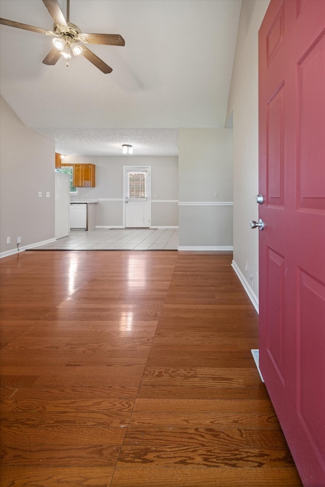 104 Hillcreek Ct, Portland, TN 37148 - unfurnished living room featuring ceiling fan, light wood-style flooring, baseboards, and vaulted ceiling