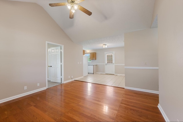 104 Hillcreek Ct, Portland, TN 37148 - unfurnished living room featuring ceiling fan, light wood-type flooring, vaulted ceiling, and baseboards