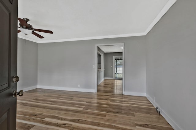 101 Walnut St, Smyrna, TN 37167 - unfurnished room with ceiling fan, wood finished floors, crown molding, and baseboards