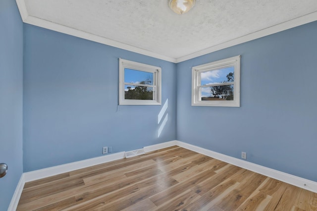 101 Walnut St, Smyrna, TN 37167 - empty room featuring baseboards, a textured ceiling, wood finished floors, and crown molding