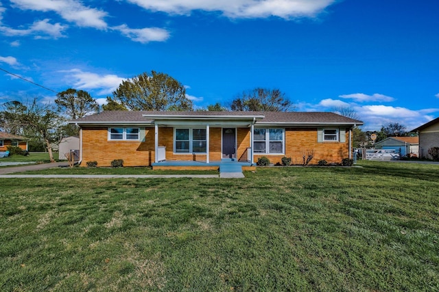 101 Walnut St, Smyrna, TN 37167 - single story home featuring a front yard, covered porch, and brick siding
