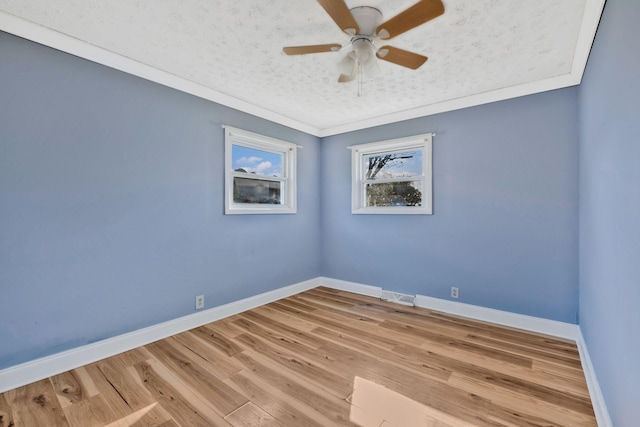 101 Walnut St, Smyrna, TN 37167 - spare room featuring a ceiling fan, baseboards, wood finished floors, and a textured ceiling